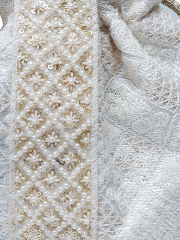 Taj Pearl Potli Bag with Handle by The Tan Clan featuring intricate pearl embroidery and traditional design.