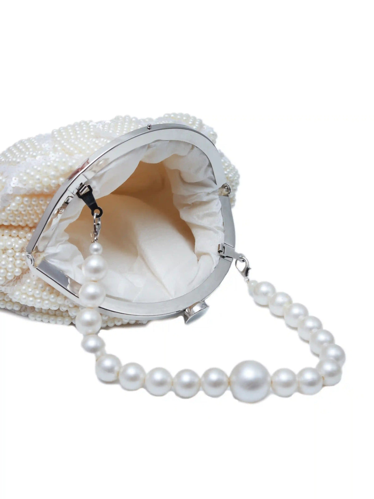 Tara Pearl Tasselled Batua handbag with detachable handle by The Tan Clan, featuring pearl details and tassel accents.