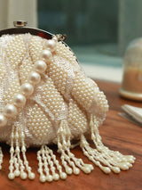 Tara Pearl Tasselled Batua by The Tan Clan featuring pearl embellishments and a detachable handle for versatile wear.