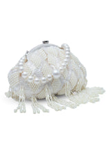 Tara Pearl Tasselled Batua with Detachable Handle by The Tan Clan, showcasing a stylish pearl-embellished traditional Indian bag with tassels.