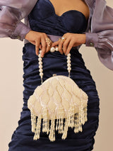 Tara Pearl Tasselled Batua bag with detachable handle by The Tan Clan, featuring pearl embellishments and tassel details.