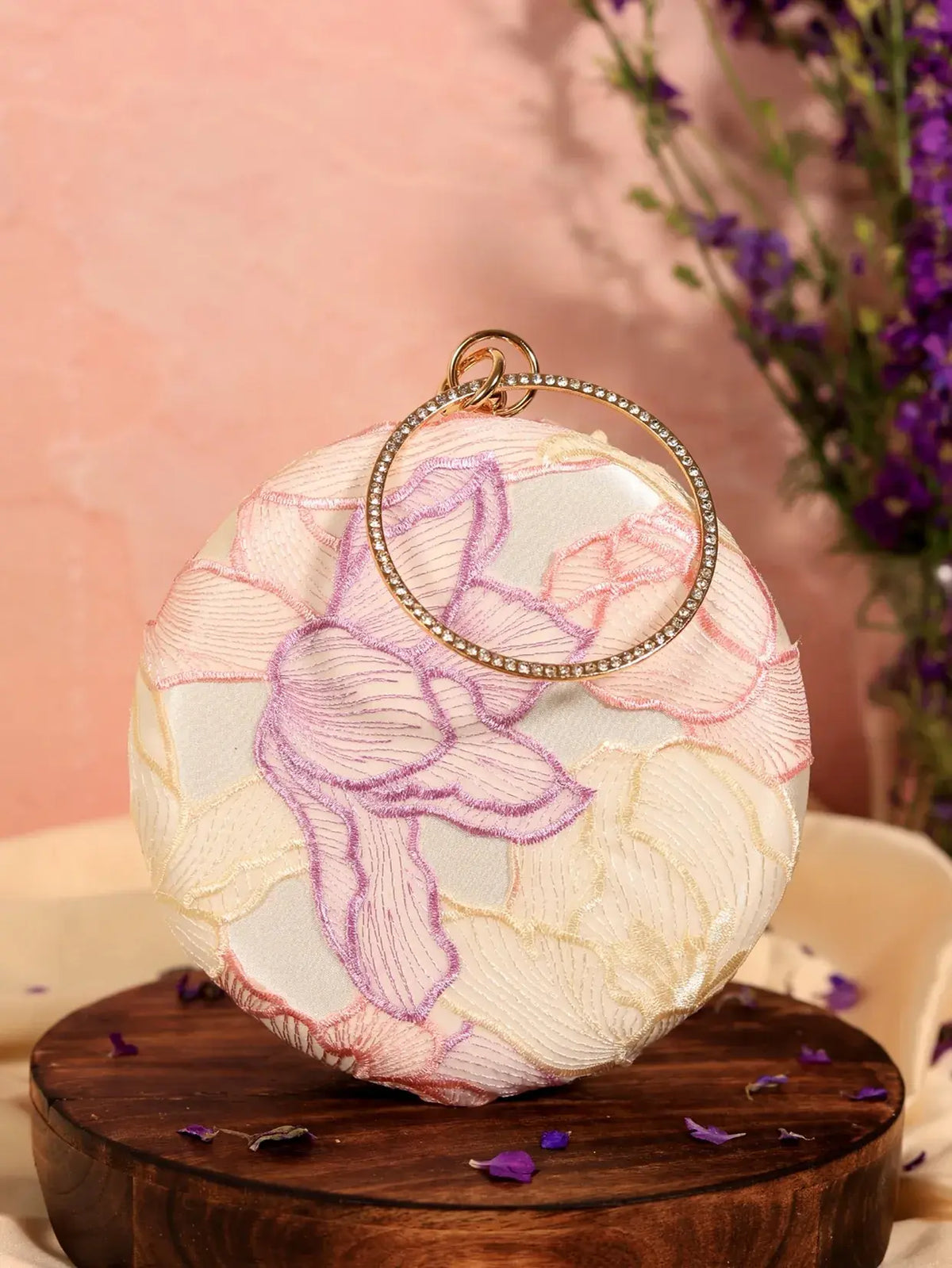 Set of three Blossom Circle bridesmaids accessories by THE TAN CLAN, featuring floral designs on neutral-toned jewelry.