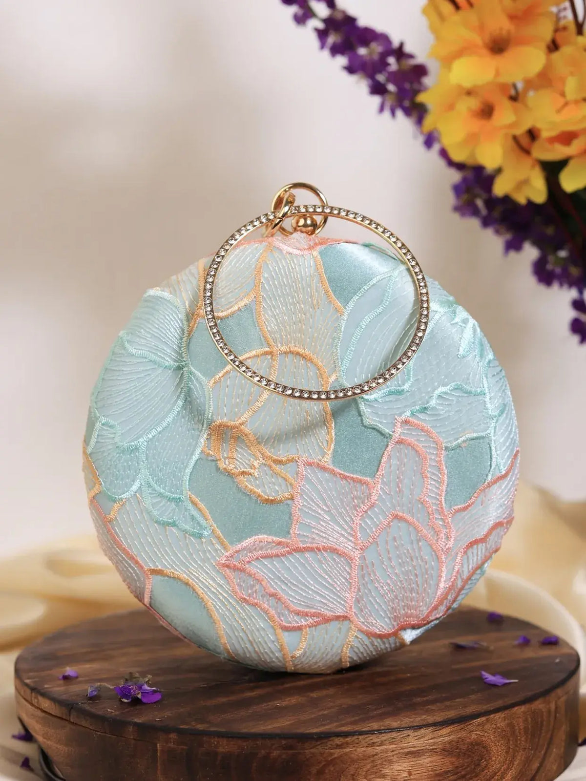 Set of three Blossom Circle bridesmaids accessories by THE TAN CLAN, featuring elegant floral designs for wedding parties.