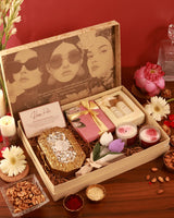Luxury hamper by The Tan Clan featuring elegant packaging and a selection of premium gourmet treats and beverages.