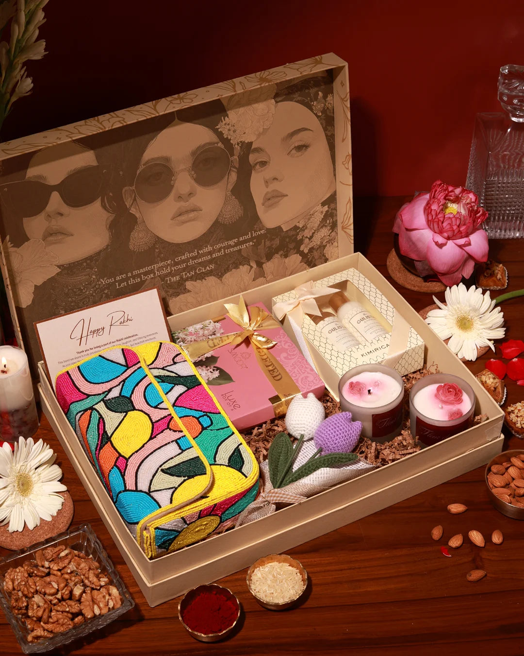 The Luxe Affair Hamper Poppy by The Tan Clan, featuring a luxury gift basket with elegant packaging and assorted premium treats.