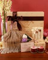The Tan Clan Luxe Blossom Hamper - Amour featuring elegant floral packaging with luxury treats and gifts inside.
