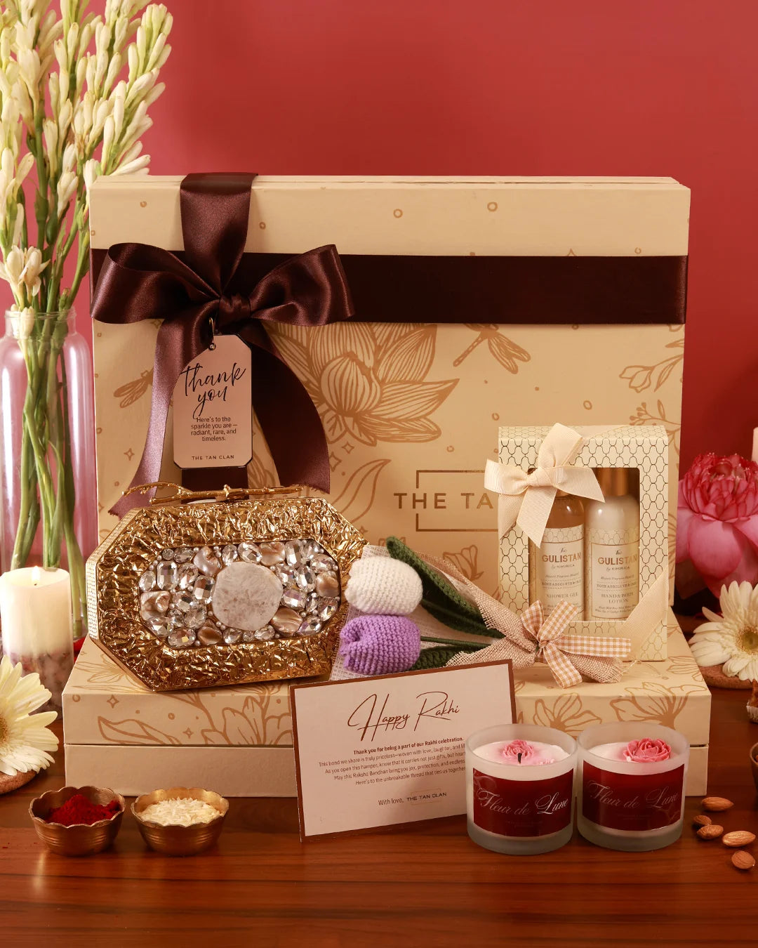 The Luxe Blossom Hamper by The Tan Clan features a stylish gift box with floral accents and luxury items inside.