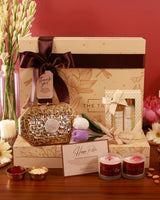 The Luxe Blossom Hamper by The Tan Clan features a stylish gift box with floral accents and luxury items inside.