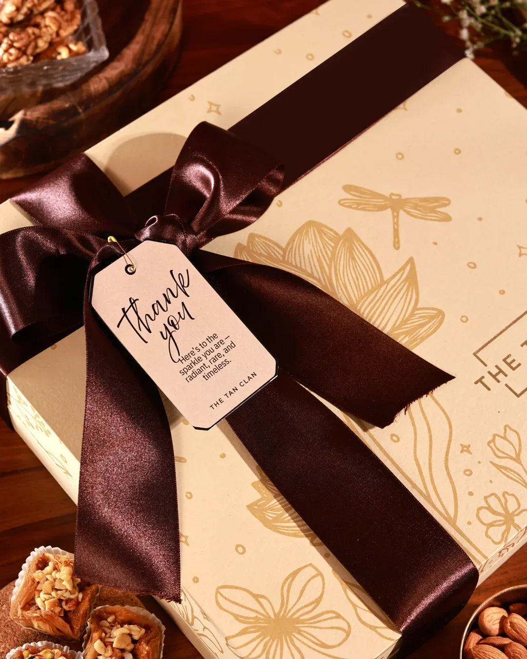 Floral Grace Hamper by The Tan Clan featuring a luxurious bouquet and elegant packaging in a stylish gift box.