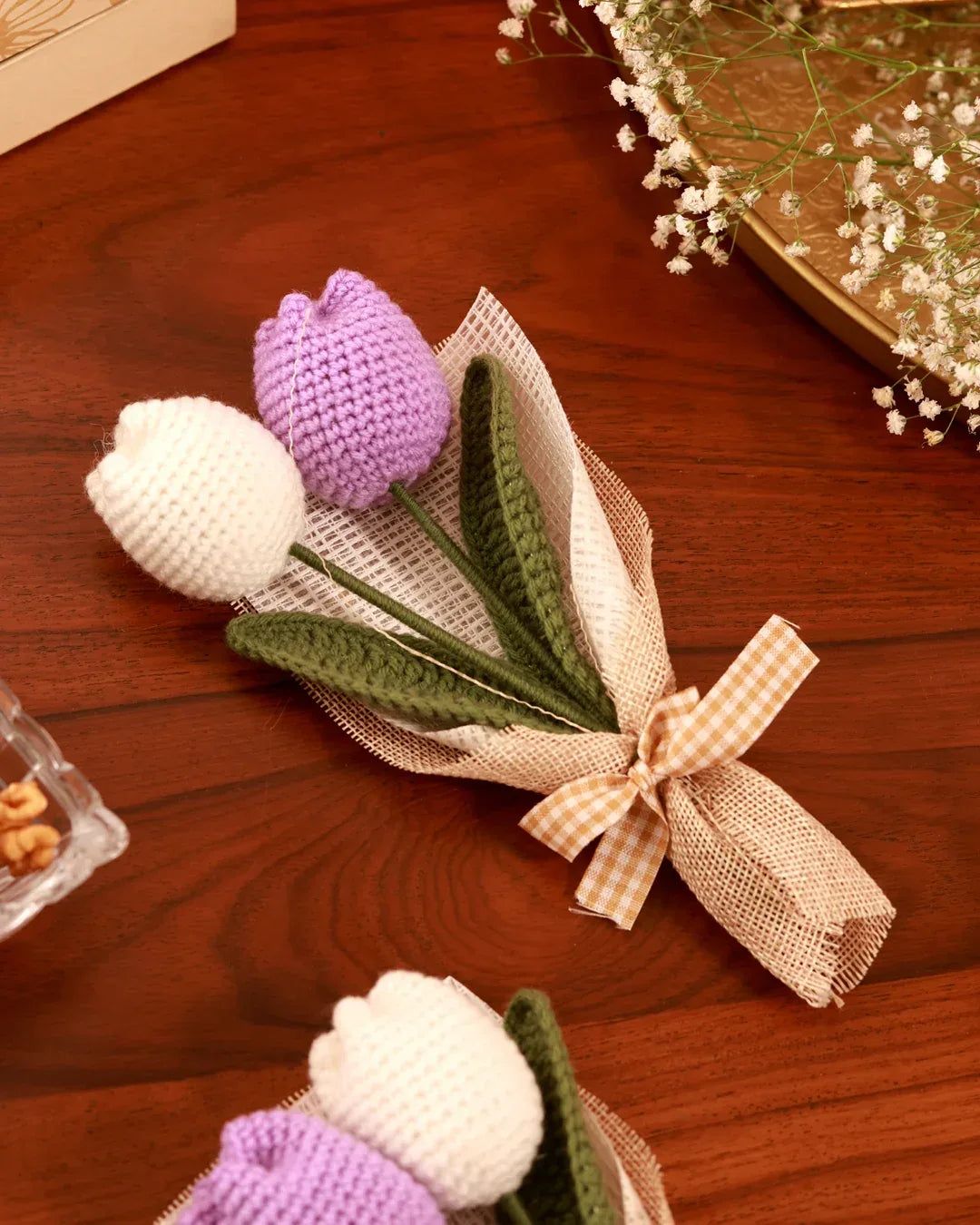 Elegant floral gift hamper from The Tan Clan featuring lush blooms, decorative wrapping, and a stylish presentation for special occasions.