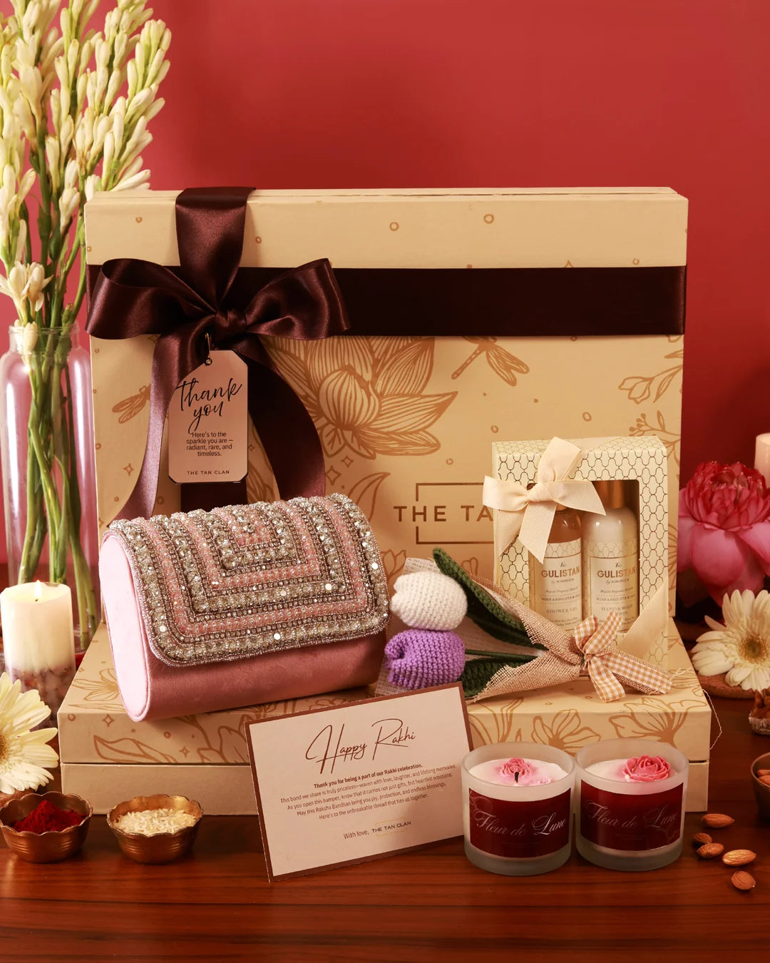 Elegant Luxe Blossom Hamper by The Tan Clan featuring a stylish presentation with flowers and luxury gift items.