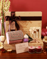 Elegant Luxe Blossom Hamper by The Tan Clan featuring a stylish presentation with flowers and luxury gift items.