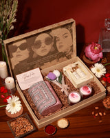 Luxurious Luxe Blossom Hamper by The Tan Clan featuring elegant floral arrangements and assorted gift items.