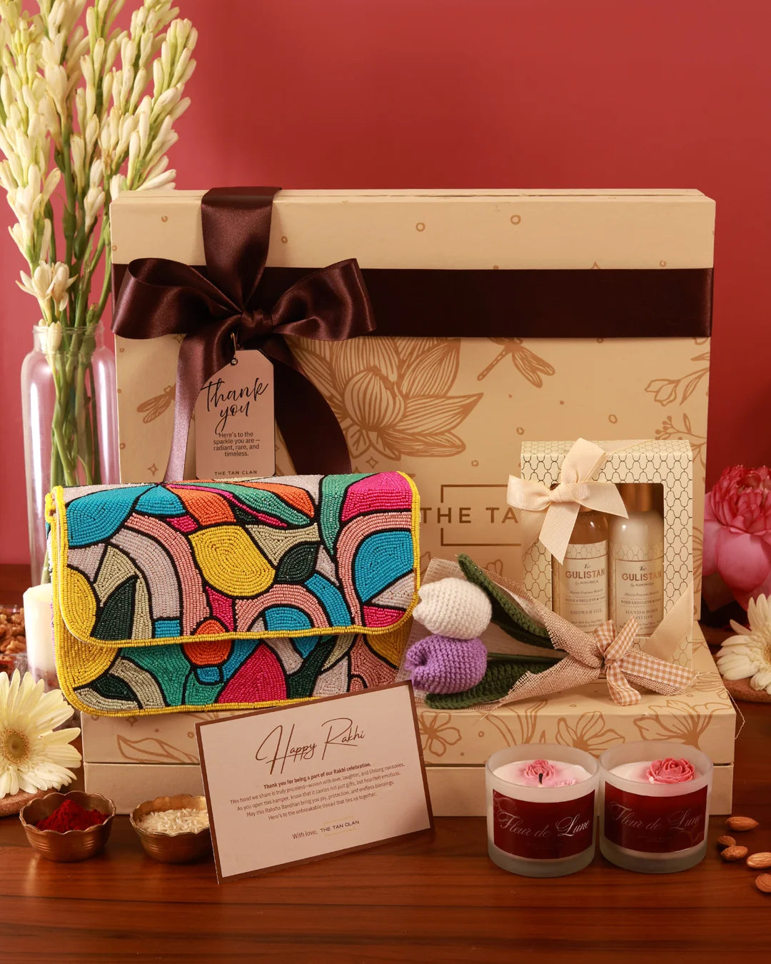 The Luxe Blossom Hamper in Poppy by The Tan Clan featuring a beautifully arranged gift hamper with flowers and luxury items.