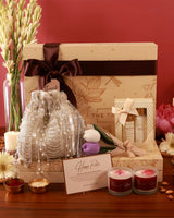 Elegant Luxe Blossom Hamper by The Tan Clan featuring a beautifully arranged selection of flowers and gift items.