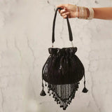 Black Twinkle Heavy Tassles Potli bag with handle by The Tan Clan, featuring decorative tassels and traditional design.