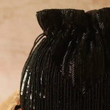 Black Twinkle Heavy Tassles Potli bag with handle by The Tan Clan, featuring intricate tassel details for traditional and festive occasions.