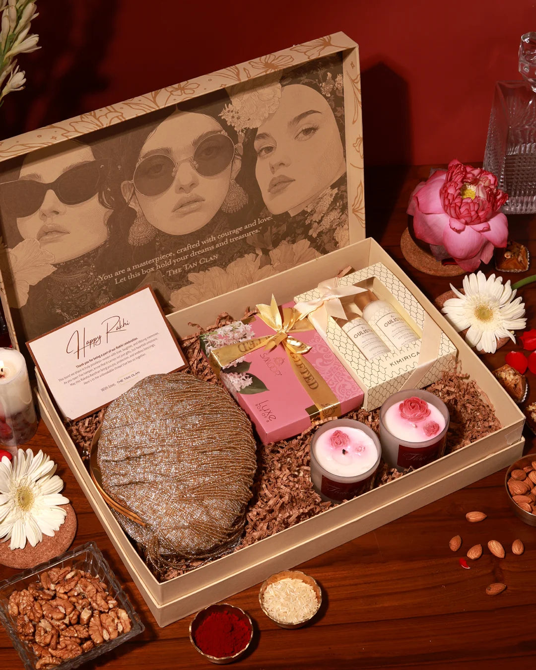 The Tan Clan Ultimate Pamper Hamper Amour with skincare products, luxurious spa items, and plush accessories in elegant packaging.