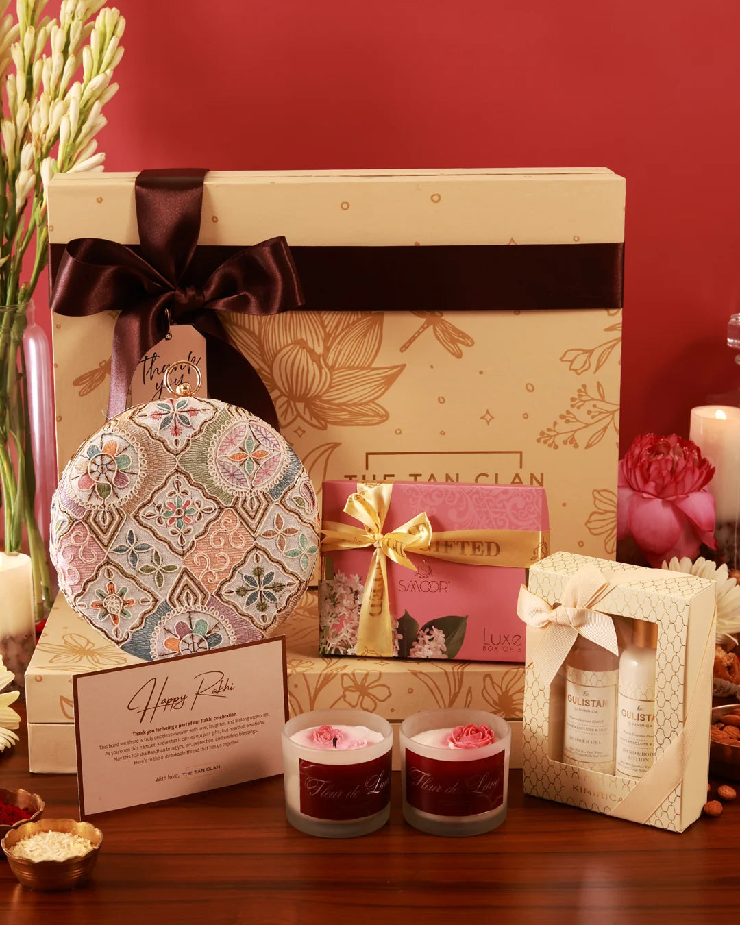 Luxury pamper hamper from The Tan Clan featuring skincare products, plush towels, and a Mughal-themed gift set.