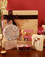 Luxury pamper hamper from The Tan Clan featuring skincare products, plush towels, and a Mughal-themed gift set.