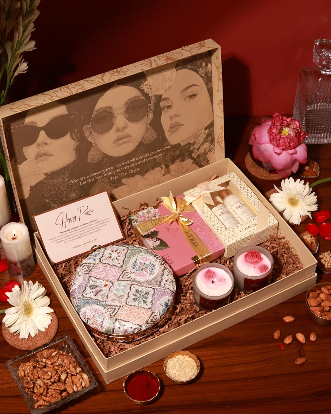 Luxury pamper hamper by The Tan Clan featuring skincare products, plush towels, and a decorative Mughal-inspired box.