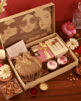 The Tan Clan The Ultimate Pamper Hamper Twinkle with skincare products, spa items, and cozy accessories arranged in a gift box.