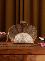 Mother of pearl clutch bag by The Tan Clan featuring a shimmering tiara design and elegant pearl accents.