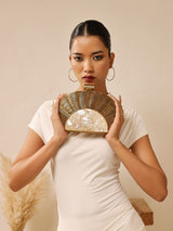 Mother of pearl Tiara clutch bag by The Tan Clan, featuring a shimmering, elegant design with a sleek, compact shape.