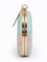Tide Blue Round Clutch by The Tan Clan featuring a smooth circular design and vibrant blue color.