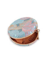 Tide Blue Round Clutch by The Tan Clan featuring a smooth, circular design and stylish compact shape.
