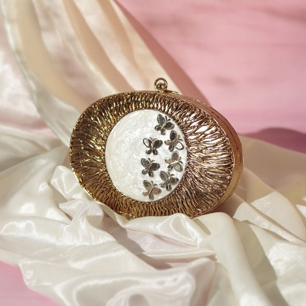 Elegant Titly Wirework clutch by The Tan Clan featuring intricate wire design and mother of pearl accents.
