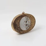 Titly wirework clutch by The Tan Clan featuring mother of pearl details and intricate handcrafted design.