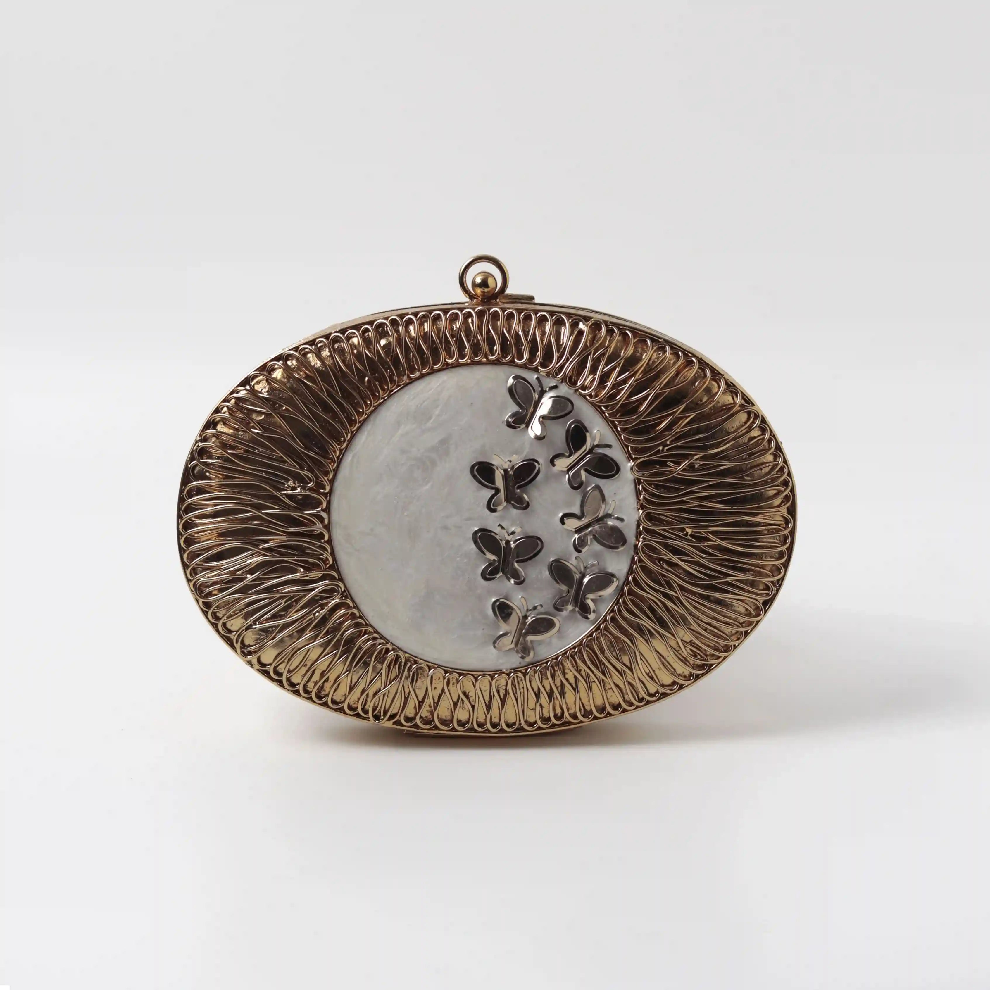 Elegant Titly wirework clutch by The Tan Clan featuring a mother of pearl design and intricate craftsmanship.