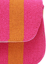 Orange and pink tulip-shaped baguette bag with a handle by The Tan Clan, featuring a stylish and colorful design.