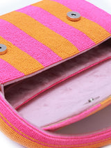 Orange and pink Tulip Baguette Bag with handle by The Tan Clan, featuring a sleek, compact design and stylish color combination.