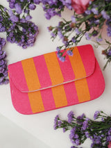 Orange and pink Tulip Baguette Bag with handle by The Tan Clan, showcasing its stylish design and vibrant color combination.