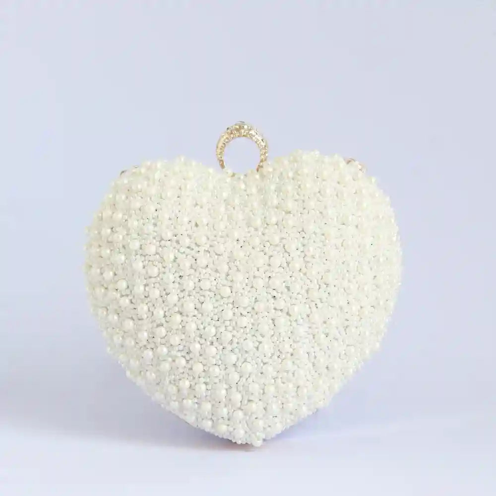 Ulfat white pearl hand-embroidered heart clutch with intricate embroidery and elegant design by The Tan Clan.