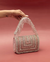 Utsav Twinkle Gold Potli and Nysa Pink Flap Bag combo from The Tan Clan, featuring elegant gold embellishments and stylish pink design.