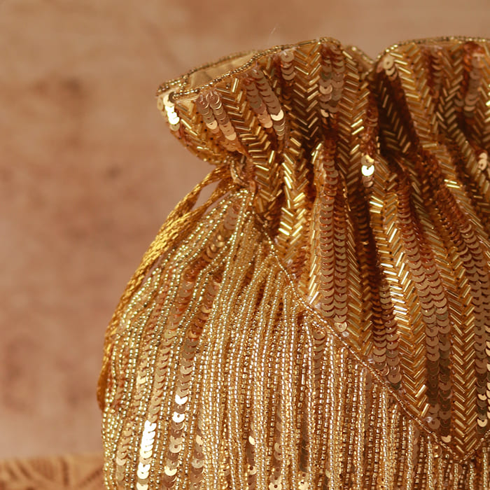 Utsav Twinkle Gold Potli and Nysa Pink Flap Bag combo by The Tan Clan, stylish and elegant accessories for special occasions.