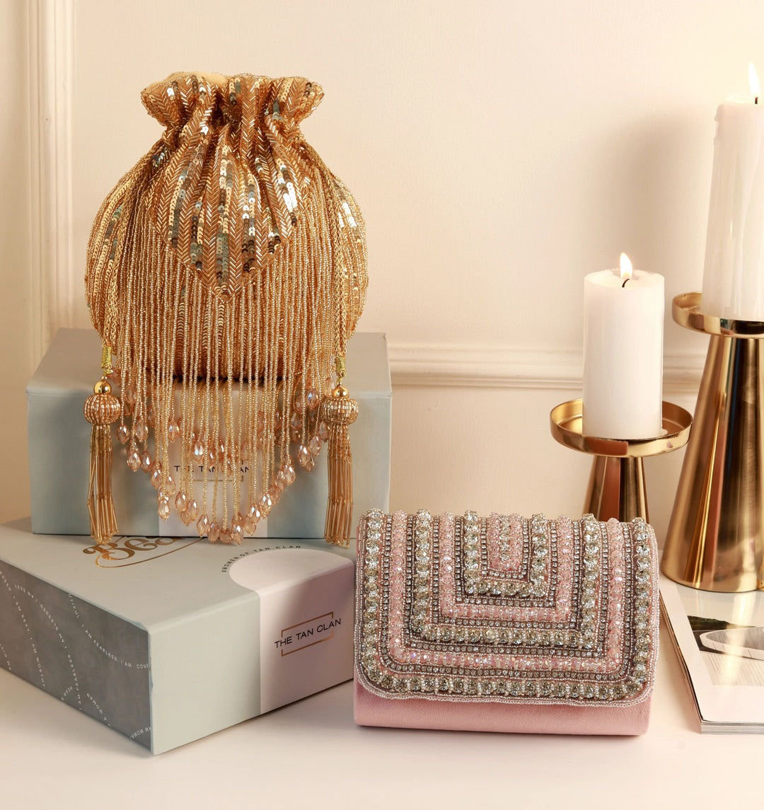Utsav Twinkle Gold Potli and Nysa Pink Flap Bag combo by The Tan Clan, showcasing elegant traditional and modern handbag designs.