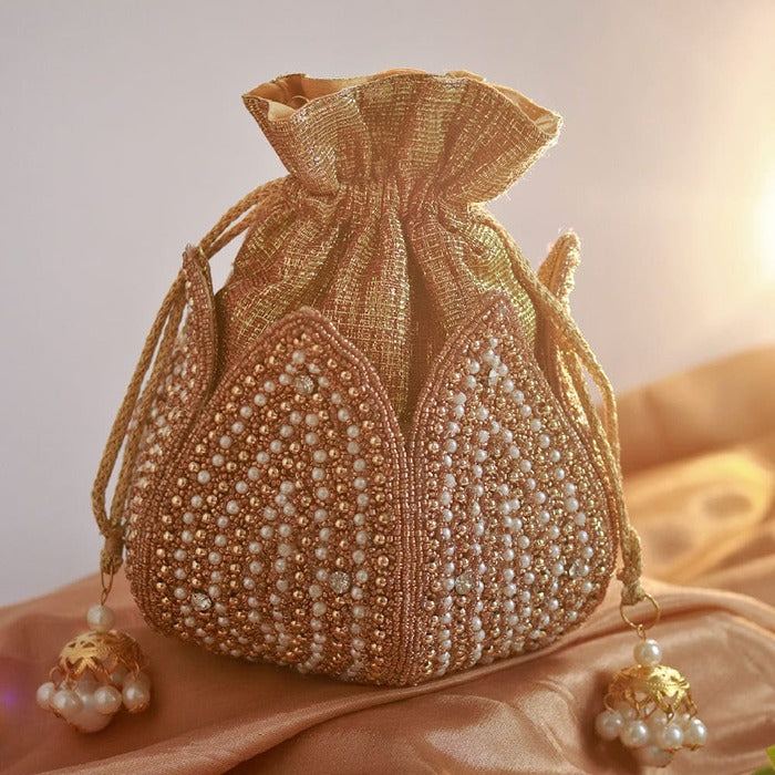 Hand-embroidered Uttara Mini Lotus Potli bag by The Tan Clan with intricate embroidery and a compact, elegant design.