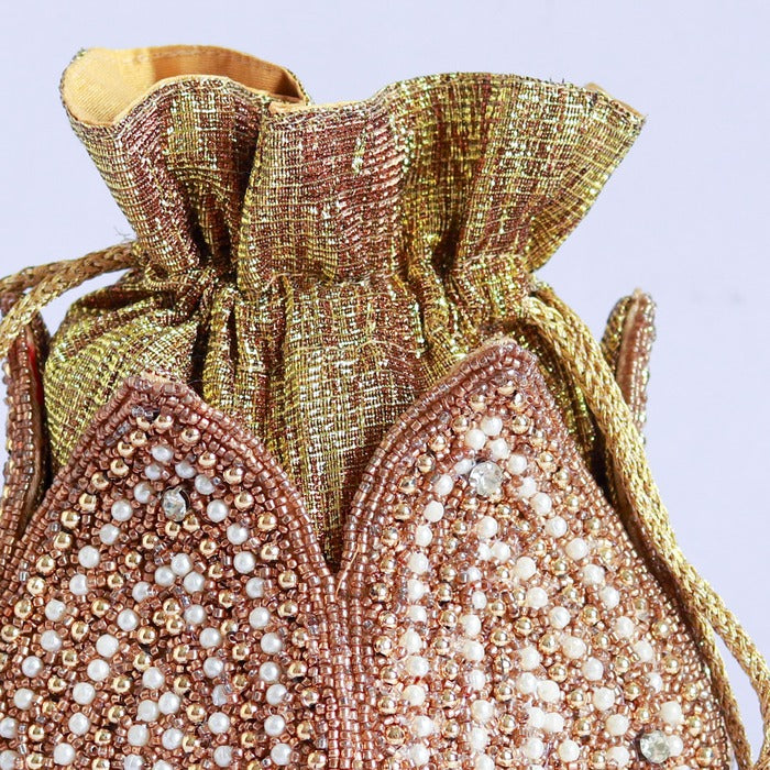 Uttara hand embroidered mini lotus potli bag with intricate embroidery, traditional Indian accessory by The Tan Clan.