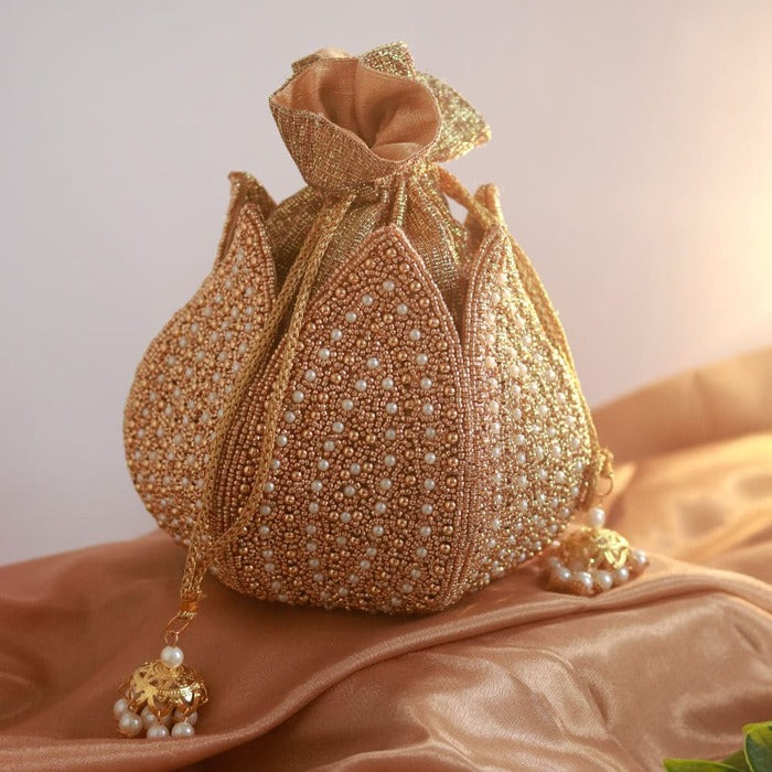 Hand-embroidered mini lotus potli bag by The Tan Clan with intricate embroidery and traditional design.