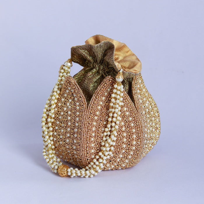 Hand-embroidered Uttara mini lotus potli bag by The Tan Clan with intricate embroidery and a compact, stylish design.