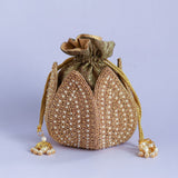 Uttara hand-embroidered mini lotus potli bag by The Tan Clan with intricate threadwork and traditional design.