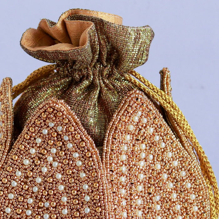 Hand-embroidered Uttara mini lotus potli bag by The Tan Clan, featuring intricate embroidery and a compact, traditional design.