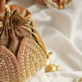 Hand-embroidered mini lotus potli bag from The Tan Clan featuring intricate embroidery and traditional design.