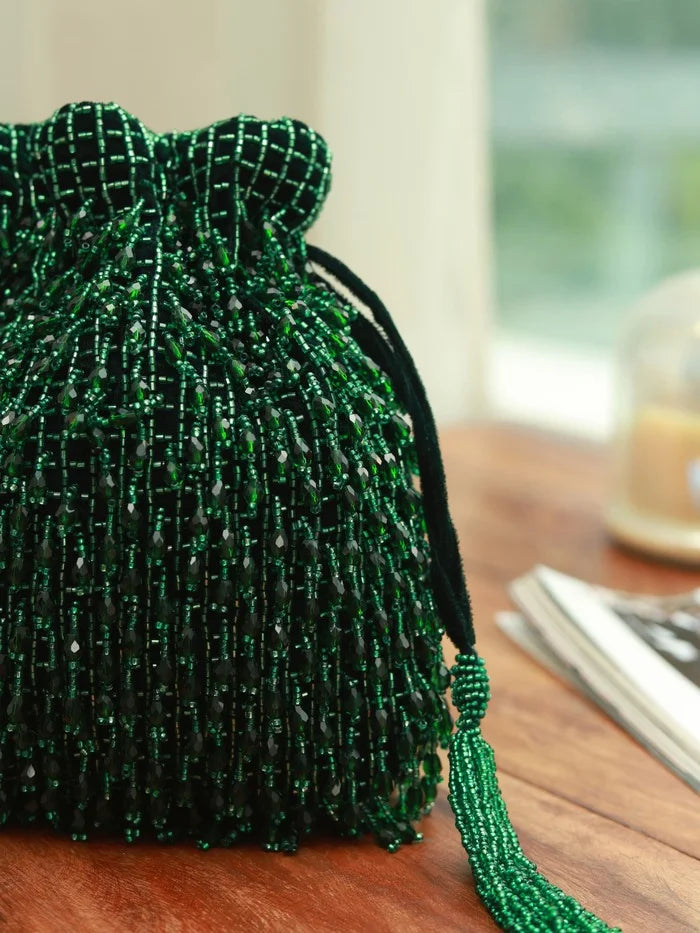 Rosa green Potli bag with handle from The Tan Clan, featuring traditional design and elegant craftsmanship.