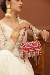 Tan leather Wedlock flap-over clutch bag by The Tan Clan with a sleek design and a fold-over closure.