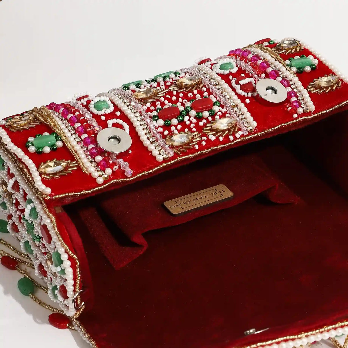 Tan Wedlock Flap Over Clutch Bag by The Tan Clan, featuring a sleek design with a flap closure and compact style.